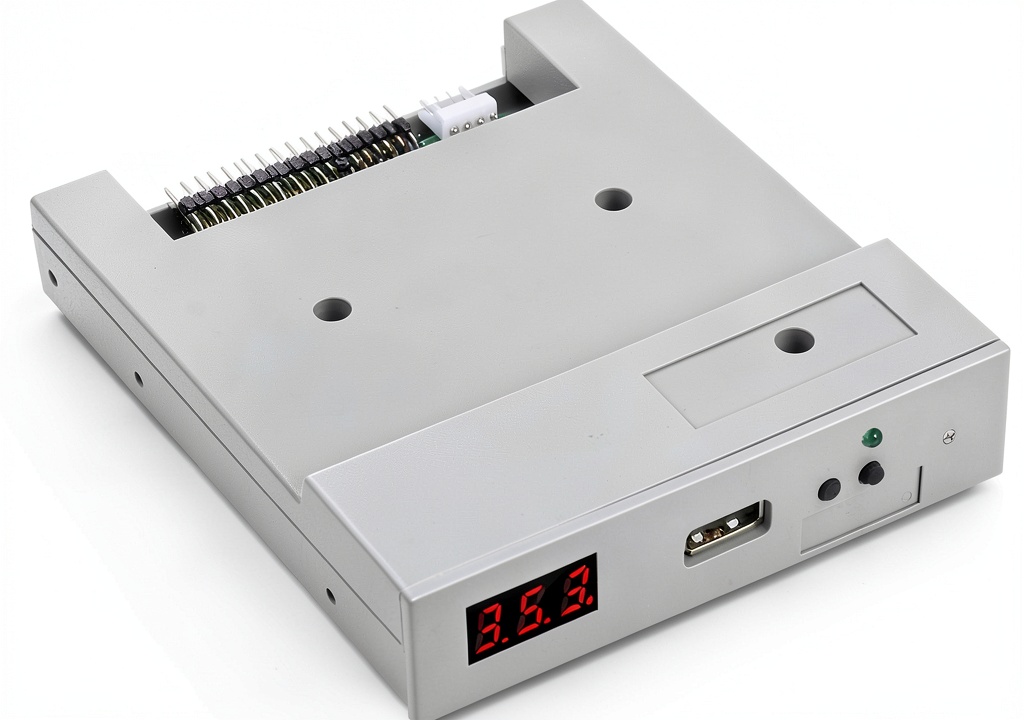 USB Floppy Drive Emulator connected to a laptop in a modern office